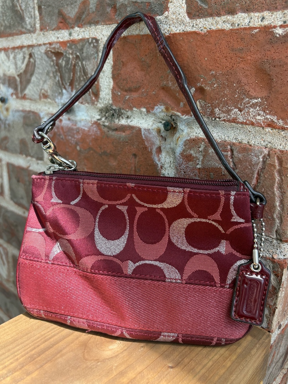 Coach signature monogram wristlet